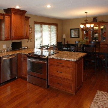 Omega Cabinetry. Destin door, Cherry wood, Nutmeg stain.