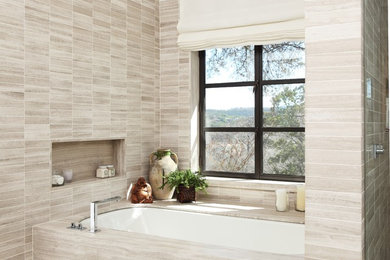 This is an example of a contemporary bathroom in Austin with an alcove tub.