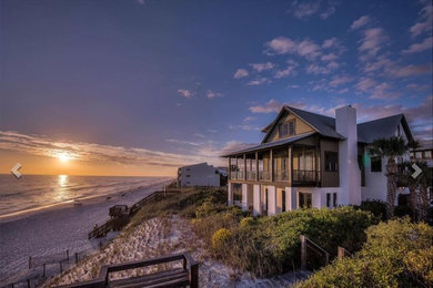 Example of a beach style home design design in Miami