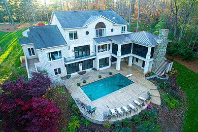 Inspiration for a large timeless gray three-story mixed siding house exterior remodel in Raleigh