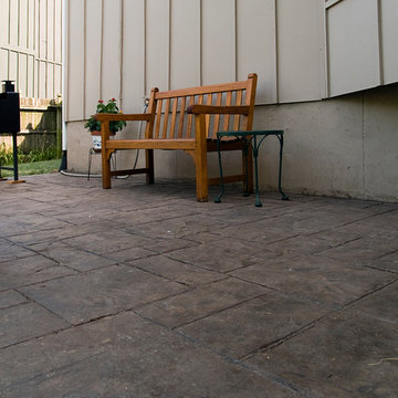 Stoerman - Cedar deck in Overland Park, Ks. Stamped concrete patio & deck light