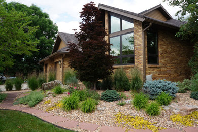 Photo of a large eclectic side yard landscaping in Denver.