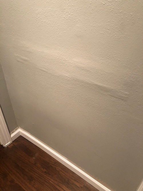 Mystery patches on old painted wall