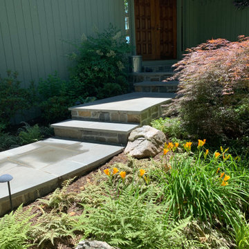 Walkway, retaining walls, plantings and stone stairs and front stoop