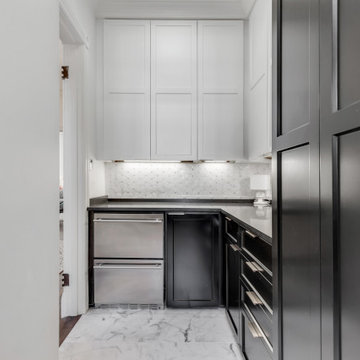 Two-Toned White and Dark Hunter Green Cabinets with Black Quartz Countertop