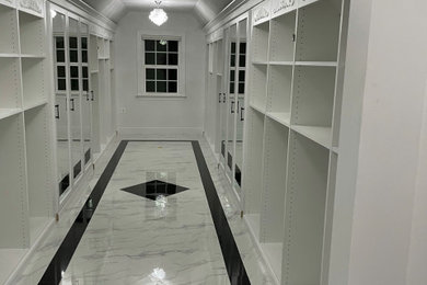 Inspiration for a huge contemporary dressing room remodel in DC Metro with recessed-panel cabinets