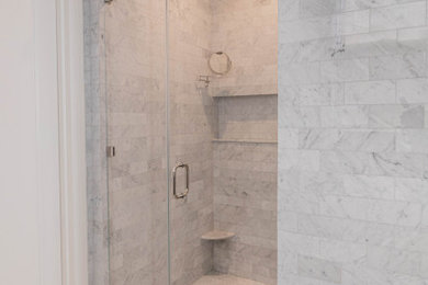 Mid-sized elegant master white tile and marble tile marble floor, white floor and double-sink alcove shower photo in New York with shaker cabinets, blue cabinets, white walls, a drop-in sink, marble countertops, a hinged shower door, white countertops, a niche, a freestanding vanity and a one-piece toilet