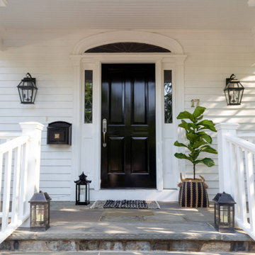 Elegant Black Front Door with Classic Porch Details