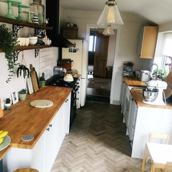 Galley kitchen in Sierra 9759 luxury vinyl planks in herringbone pattern - Vinyl Flooring