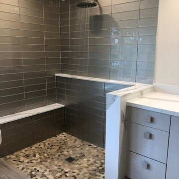 Walk-in shower with no step. Shower door optional.