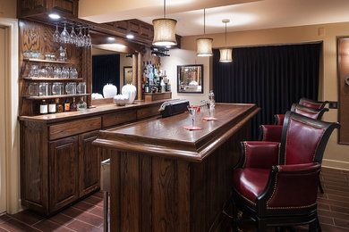 Mid-sized elegant single-wall vinyl floor and brown floor seated home bar photo in New York with raised-panel cabinets, dark wood cabinets, wood countertops and wood backsplash
