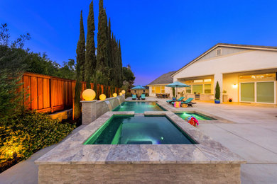 Pool landscaping - mid-sized contemporary backyard concrete and rectangular lap pool landscaping idea in San Francisco