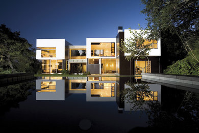 Inspiration for a large modern white two-story metal flat roof remodel in Los Angeles