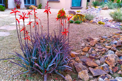 This is an example of a large southwestern drought-tolerant, desert and full sun front yard landscaping in Las Vegas.