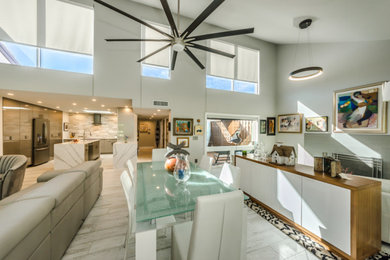 Inspiration for a large eclectic porcelain tile and white floor great room remodel in Tampa with white walls and a wood stove