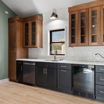 Two-Tone Kitchen Remodel in Libertyville Featuring Glass Upper Cabinets