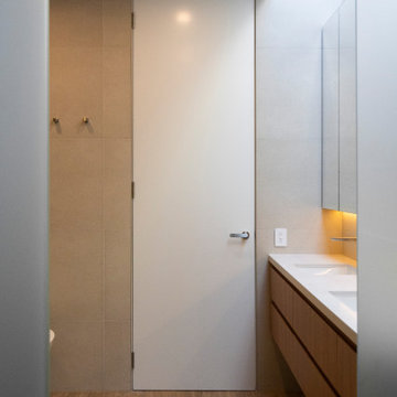 The closed door sits perfectly flush against the wall when closed.