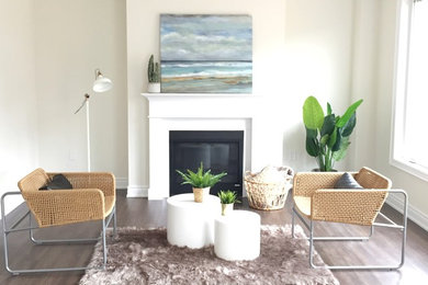 Example of a mid-sized 1950s open concept brown floor living room design in Toronto with white walls, a standard fireplace, a wood fireplace surround and no tv