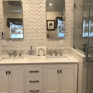 White Master Bath using a mix of Quartz, Porcelain tile and Natural stone mosaic