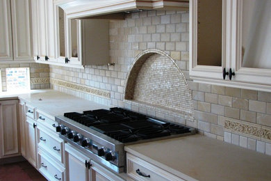 Inspiration for a large timeless eat-in kitchen remodel in Chicago with beige backsplash and ceramic backsplash