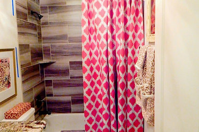 Large kids' multicolored tile bathroom photo in Other with furniture-like cabinets, medium tone wood cabinets and granite countertops