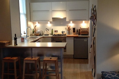 Example of a cottage chic kitchen design in Sussex