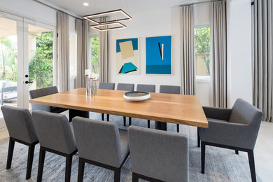 Trendy gray floor dining room photo in Los Angeles with white walls