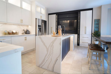 Eat-in kitchen - large contemporary u-shaped ceramic tile and white floor eat-in kitchen idea in Toronto with raised-panel cabinets, white cabinets, quartzite countertops, white backsplash, quartz backsplash, colored appliances, an island and white countertops