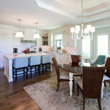 White Kitchen with Gray Quartz Countertops, Farmhouse Sink and Hardwood Floors