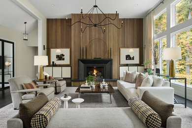 This is an example of a traditional formal living room in Detroit with a standard fireplace.