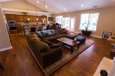 Living room - large craftsman formal and open concept medium tone wood floor and brown floor living room idea in Seattle with beige walls, a standard fireplace, a tile fireplace and no tv