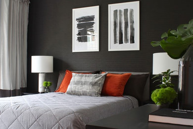 Example of a trendy dark wood floor and brown floor bedroom design in New York with black walls