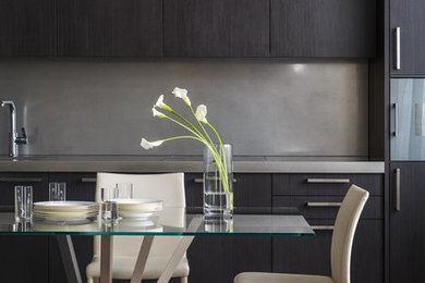 Contemporary kitchen in Moscow with flat-panel cabinets, black cabinets, grey splashback and no island.