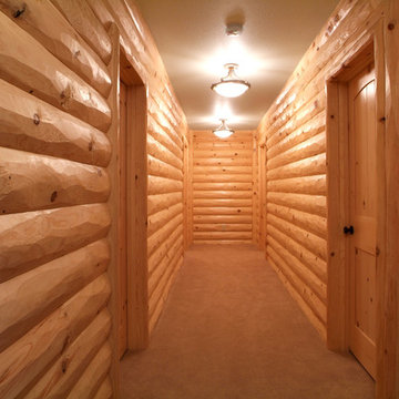 Peeled hewn knotty pine half log siding