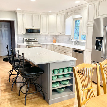 Two-Tone Kitchen Remodel With Single Level Island And Quartz Counters