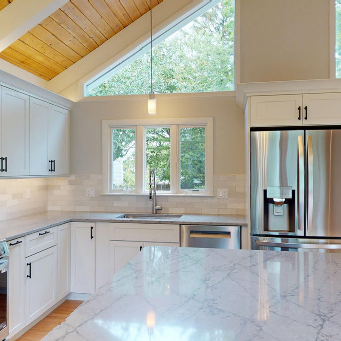 A kitchen with a high ceiling