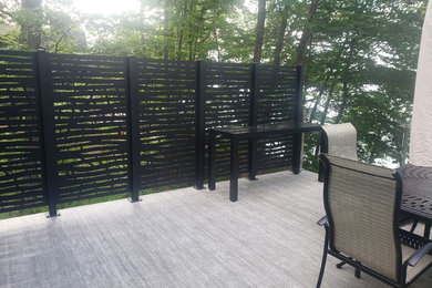 Deck - mid-sized backyard deck idea in Other with no cover