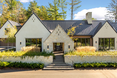 Inspiration for a transitional exterior home remodel in Minneapolis with a metal roof