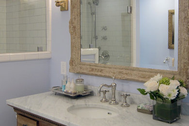 Small transitional master white tile and ceramic tile marble floor alcove shower photo in Los Angeles with marble countertops, blue walls, furniture-like cabinets, distressed cabinets and an undermount sink