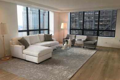 Large transitional open concept light wood floor living room photo in Chicago with white walls, a standard fireplace and a stone fireplace