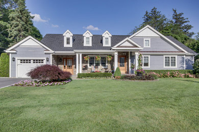 Mid-sized transitional blue one-story mixed siding exterior home idea in New York with a mixed material roof