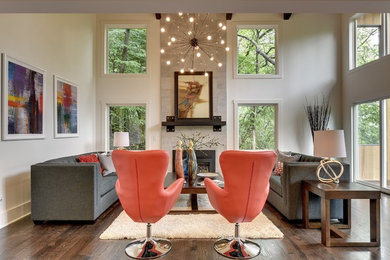 Inspiration for a transitional dark wood floor living room remodel in Minneapolis with beige walls, a standard fireplace and a tile fireplace