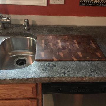 Chisel Edge Concrete Countertop With Walnut and Oak Chopping Board