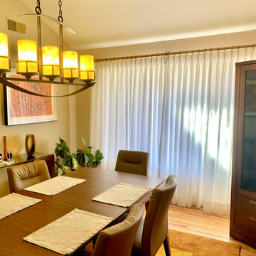 White Lined Linen Pinch Pleat Drapes on Brass TRAX Rod in Dining Room