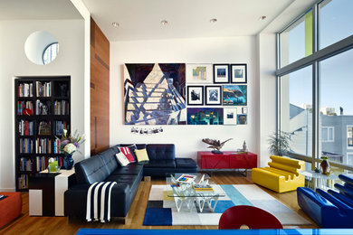 Example of a mid-sized eclectic formal and open concept medium tone wood floor living room design in San Francisco with white walls and no tv