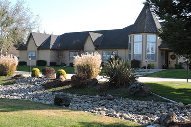 Example of a huge classic beige two-story stucco house exterior design in Sacramento