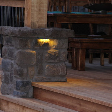 Deck lighting using low voltage under railing LED lights.
