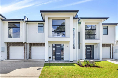 Mid-sized contemporary two-storey white exterior in Adelaide.