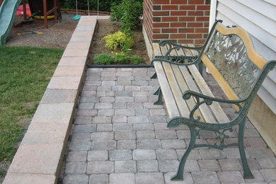 This is an example of a small traditional shade backyard concrete paver landscaping in Orange County for summer.