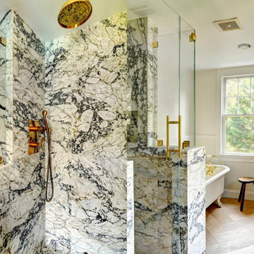 Striking Primary Bath: Calacatta Picasso Marble & Brass